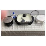 Waffle Irons, ( white iron has one leg broke)