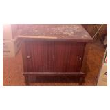 Small cabinet on legs w/sliding doors