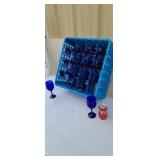 16 blue stem wine glasses in plastic tray.