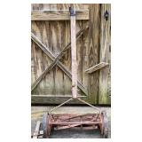 Vintage old reel mower with broken handle