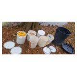 5 gallon buckets and a trash can consist seeing