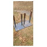 2 metal stands out of a factory