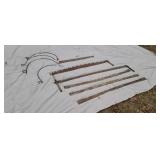 Cross saws  old hay rake teeth.