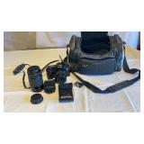 Canon camera, extra lens and bag (no charger)
