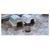 Two fiberglass dog houses & bowl.