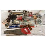 Vintage oil cans, wire, hand saws and hardware