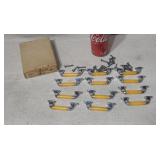 Old store stock bakeolite 12 drawer bar pulls.