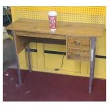 Knee hole desk on chrome legs.