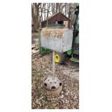 Large mail box on stand.