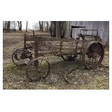 Old horse drawn steel wheel manure spreader.