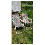 Two folding lawn chairs