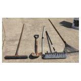 Garden tools push brooms  shovel  leaf rake.