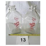 2 DAIRY LANE GLASS MILK BOTTLES