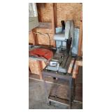 Makita 16" metal chop saw on stand.