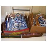 TUB FULL OF CLOTHES HANGERS