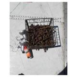 Wire milk crate full of bolts