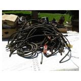 Large stack of various hydraulic hoses