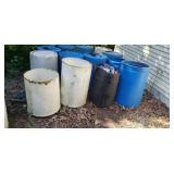plastic barrels one with aluminum cans