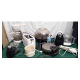 Kitchen appliances including toaster, coffee pot,