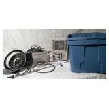 Titan heater, fan radio, vintage alarm clock in a