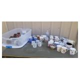 Tote with lid full of coffee and tea cups some