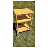 Vintage metal utility cart on wheels