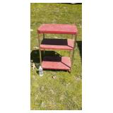Red metal utility cart with wheels