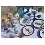Wine glasses, decorative Mason jars, saucers and
