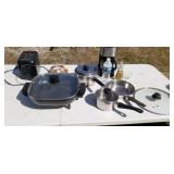 Tote full of kitchen supplies including Rival