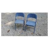 Two metal folding chairs
