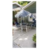 Glass top patio table with umbrella and 4 chairs