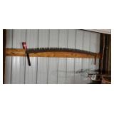 Old two man crosscut saw arched
