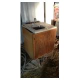 Lavatory base and bar stainless steel sink.