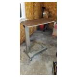 Adjustable bed side table