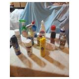 TABLE FULL OF CLEANERS, BUG SPRAY, ETC