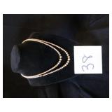 DBL STRAND OF FAUX PEARLS DISCOLORING