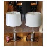 Pair of stainless steel and glass lamps