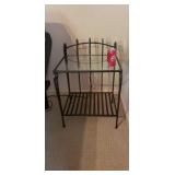 Rod iron in table with glass top.