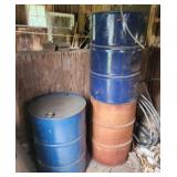 Three  55 gallon steel drums.