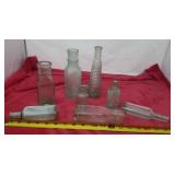 Old bottles includes Dr pitcher, Kraft, Piso