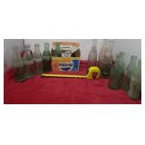 Old glass Pepsi and coca cola bottles w cardboard