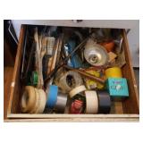 Contents in drawer ,duct tape,  paint brushes,