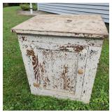 Old oak one door cabinet 24" tall 22" wide.