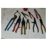Tin snips wire strippers  snap wring plyers.
