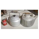 Two old aluminum kettles