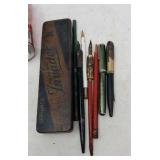 Old fountain pens one with a 14 k  gold tip