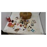 Tin with sewing supplies