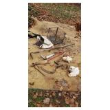 Garden tools  sea shells  wire milk crate.