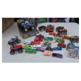Some Hot Wheels and other toy cars and trucks