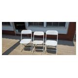 Three folding chairs